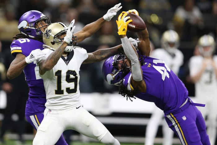 Jan 5, 2020; New Orleans, Louisiana, USA; Minnesota Vikings defensive back Anthony Harris (41) intercepts a pass interned for New Orleans Saints wide receiver Ted Ginn (19) as Minnesota cornerback Trae Waynes (26) backs up the play during the second quarter of a NFC Wild Card playoff football game at the Mercedes-Benz Superdome. Mandatory Credit: Chuck Cook -USA TODAY Sports